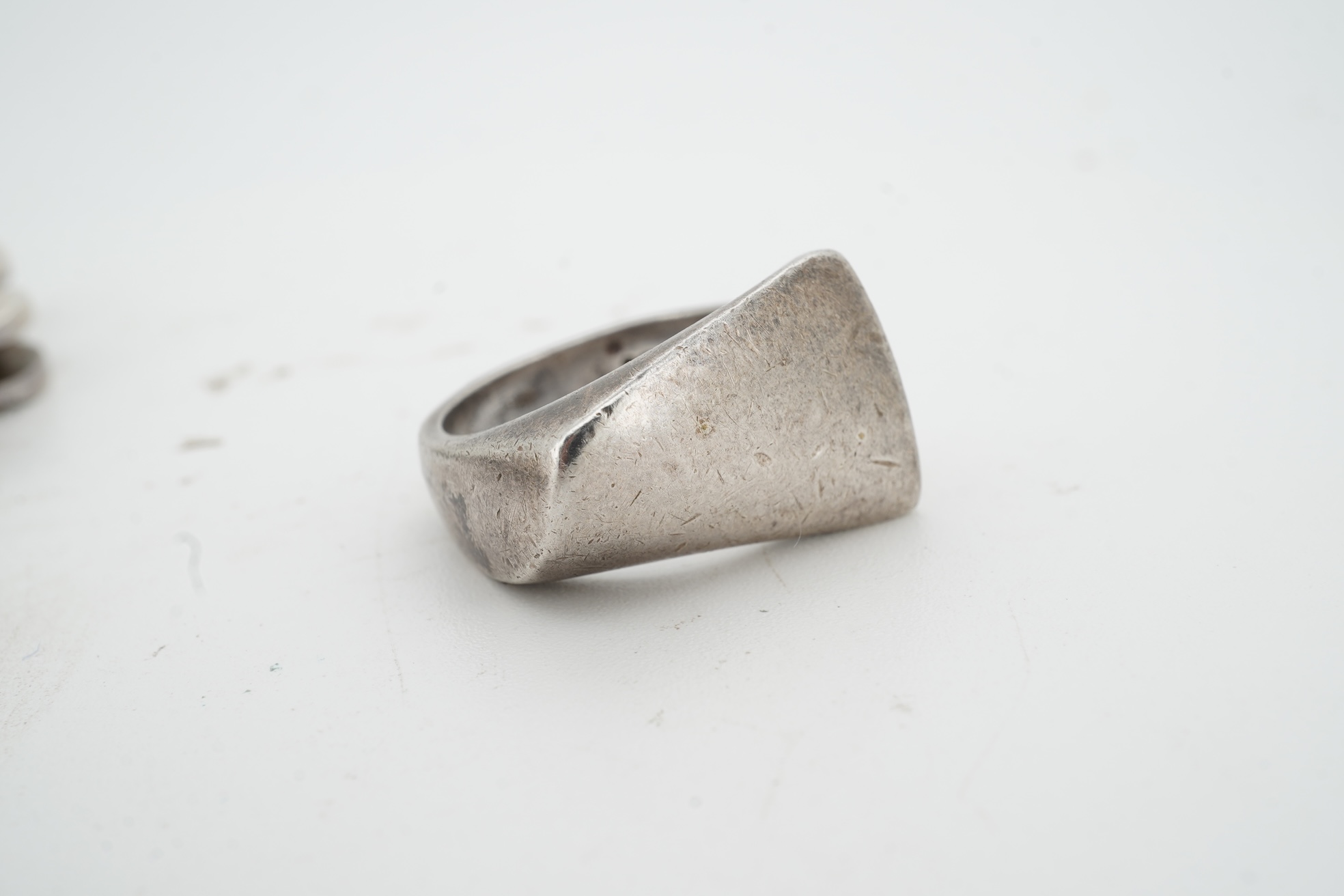 Nanna Ditzel for Georg Jensen, a silver bracelet, circa 1972, and a Georg Jensen ring, circa 1968, the bracelet composed of polished oval links with a concealed hoop clasp, length approximately 17cm, signed Georg Jensen,